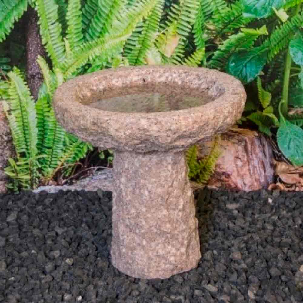 Pink round birdbath on pedestal H. 25 cm.